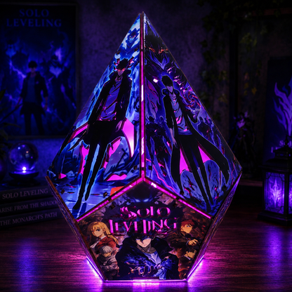 A faceted crystal-like lamp or decorative object featuring anime artwork from Solo Leveling, glowing with purple and pink light on a dark tabletop. The product is shown in a styled indoor setting with ambient lighting and background decor.
